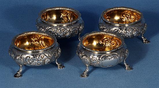 A set of four Victorian embossed silver table salts, by Roberts & Briggs, height 47mm, weight 12.8oz/401grms.